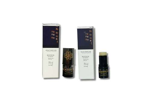 Set of perfume bottles and packaging on a white background