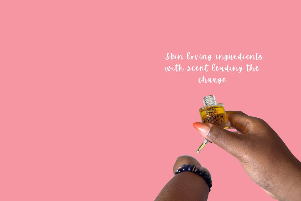 Hand holding a small bottle with a dropper against a pink background, featuring text about skin-loving ingredients.
